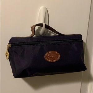 Longchamp small makeup or pencil bag.